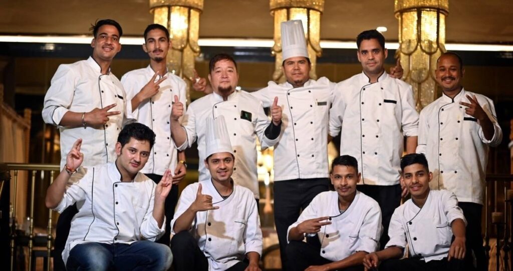 a group of men wearing chef's uniforms